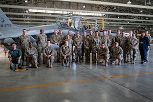 U.S. Air Force service members assigned to the 35th Fighter Wing pose for a group photo with Japan Air Self-Defense Force personnel during the Wild Weasel immersion tour