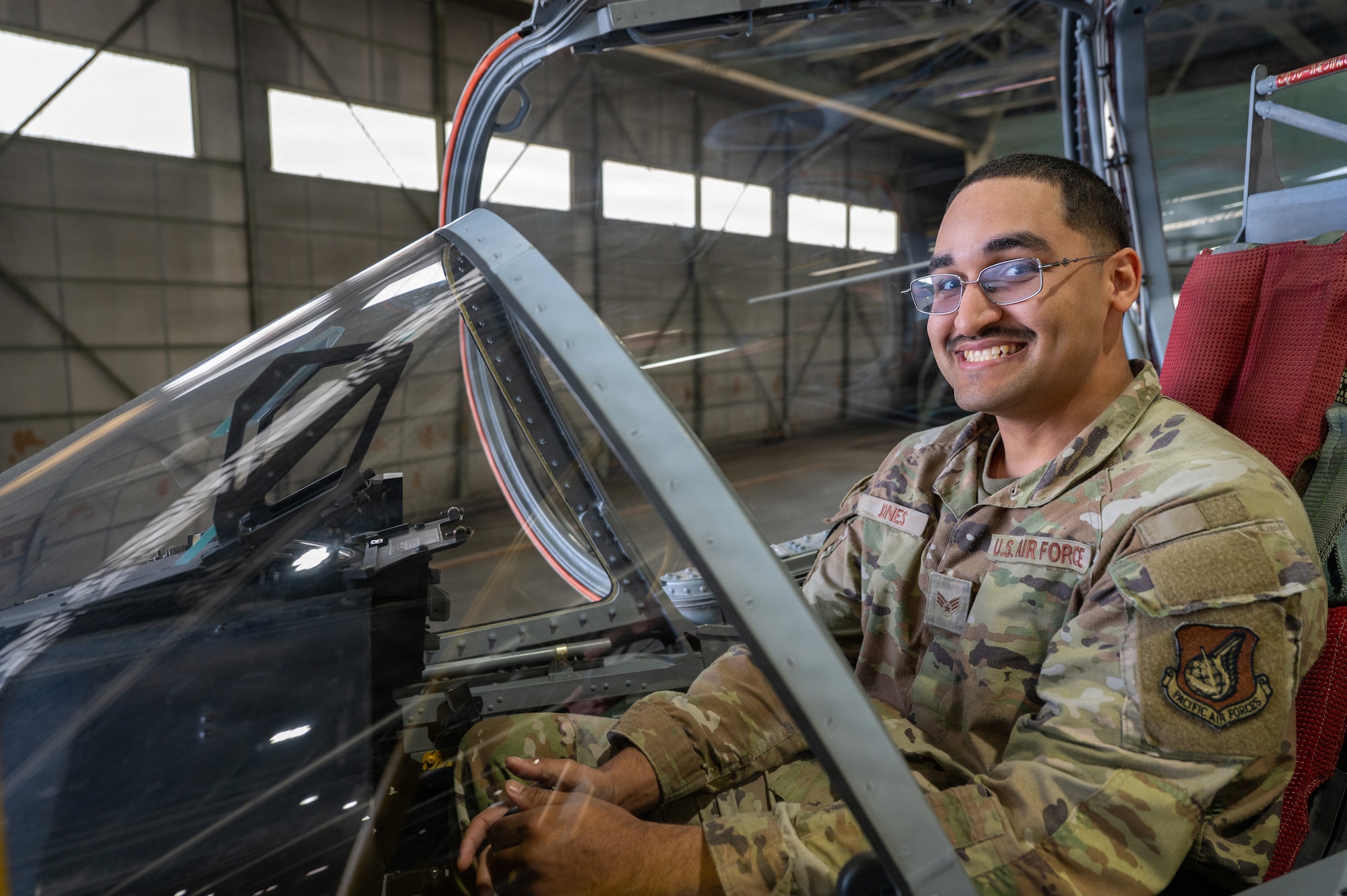 U.S. Air Force Senior Airman Tyrese Jones, 35th Logistics Readiness Squadron vehicle operator, receives a Japan Air Self-Defense Force Kawasaki T-4 training aircraft familiarization during a Wild Weasel immersion tour