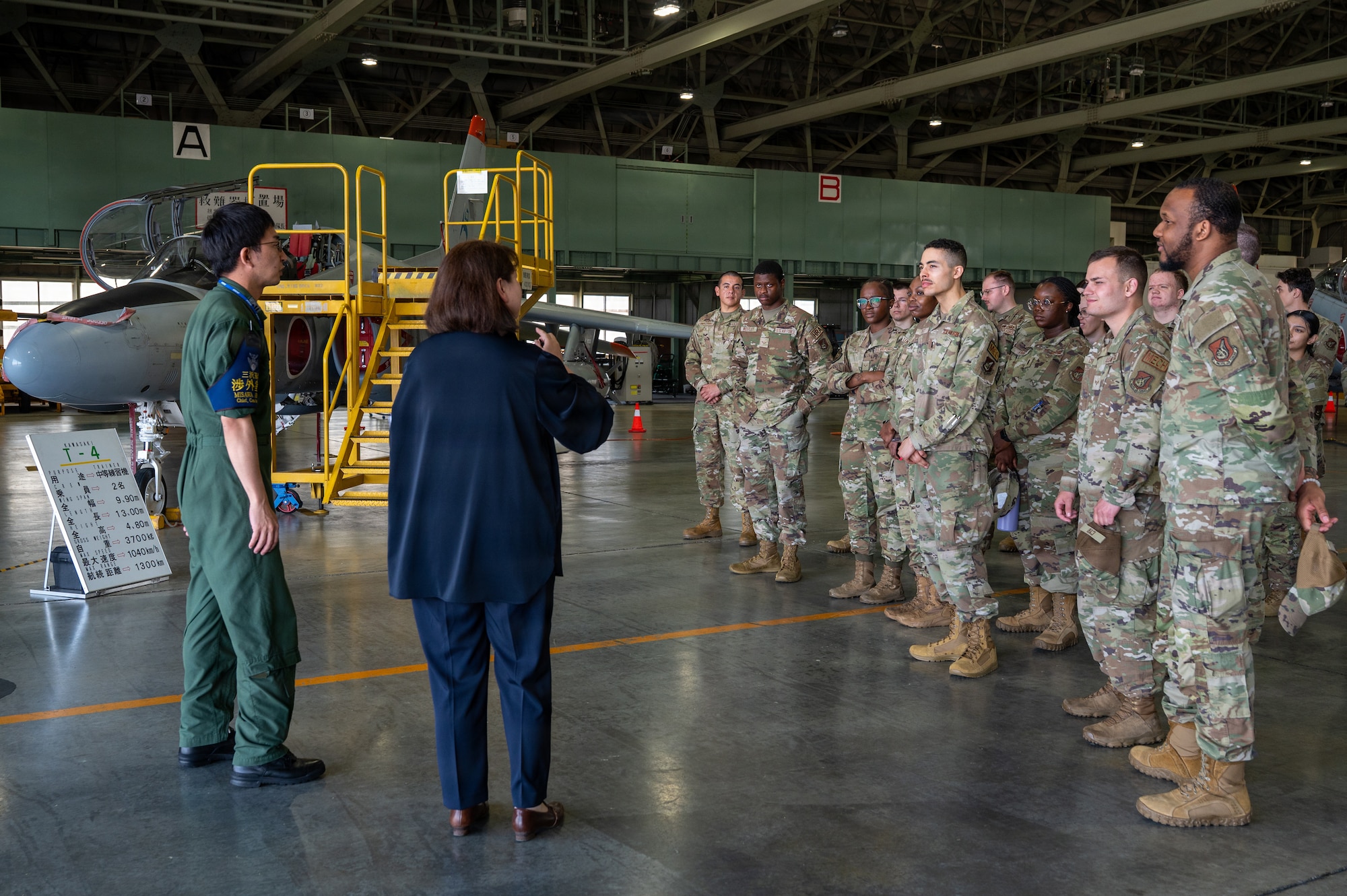 U.S. Airmen assigned to the 35th Fighter Wing receive a mission brief from Japan Air Self-Defense Force personnel during a Wild Weasel immersion tour