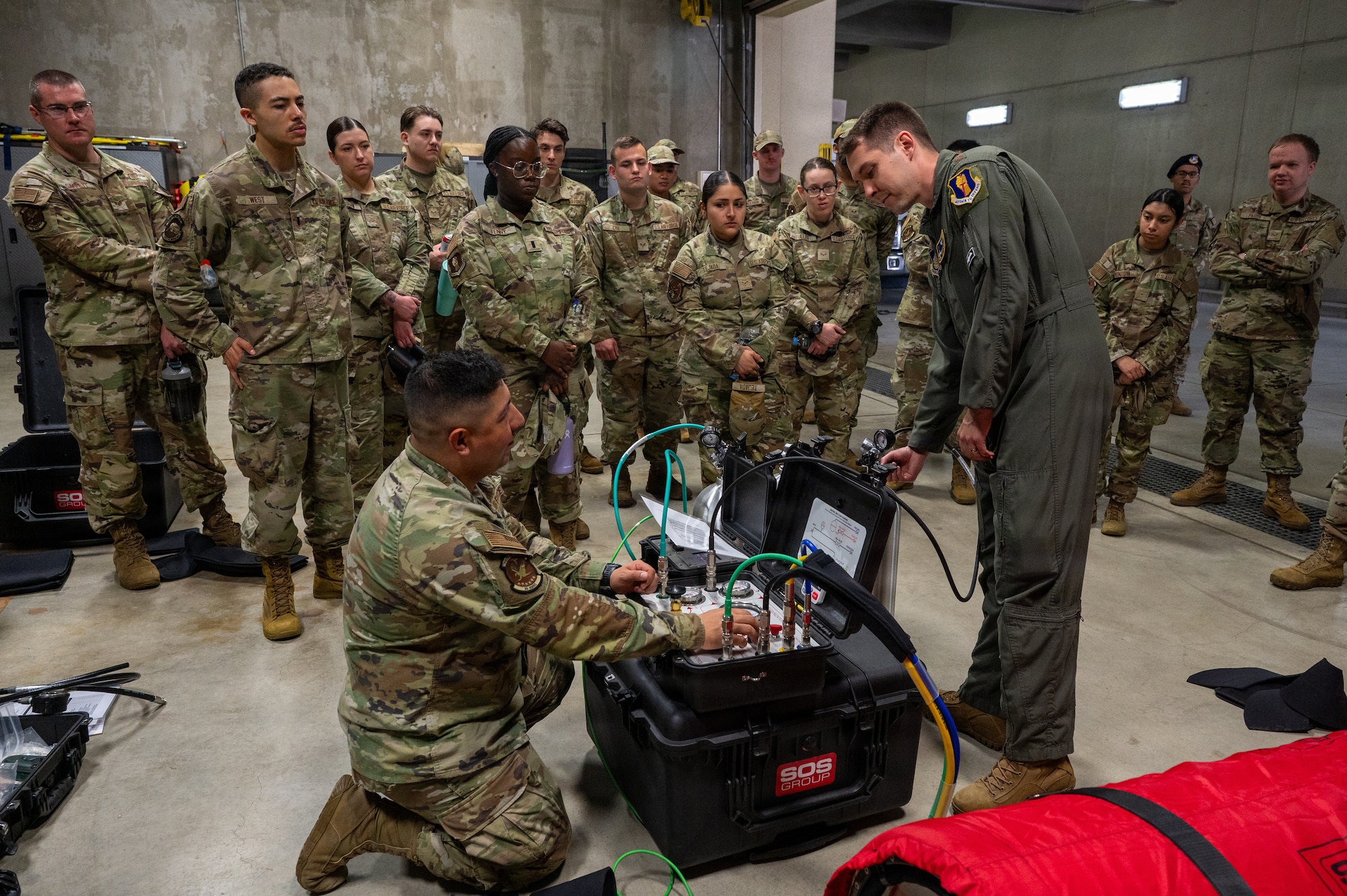 U.S. Airmen assigned to the 35th Fighter Wing observe in a medical readiness demonstration during a Wild Weasel immersion tour at the Aerospace Medicine Clinic