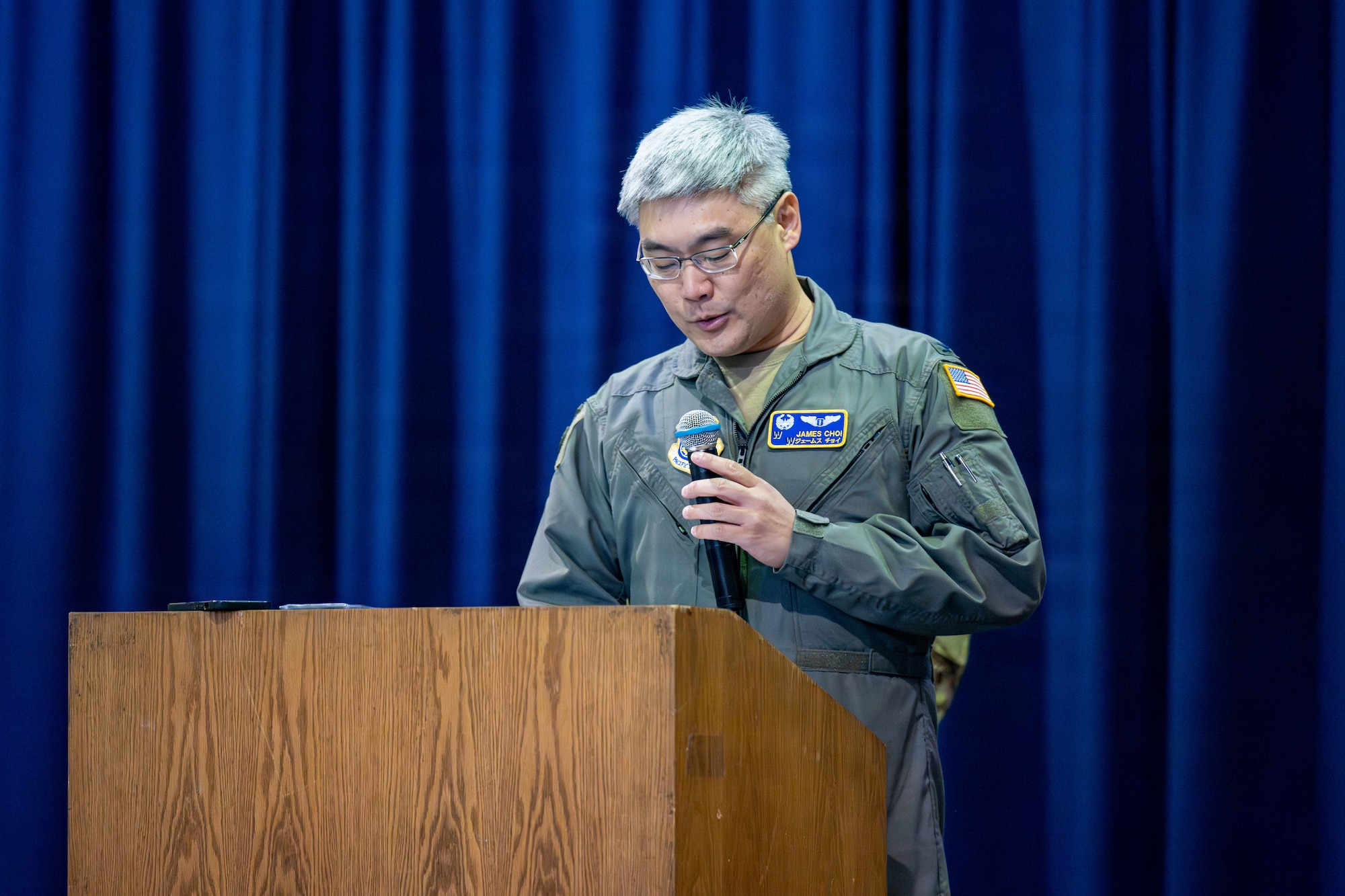 U.S. Air Force Col. James Choi, incoming 35th Medical Group commander, gives a speech during a change of command ceremony.