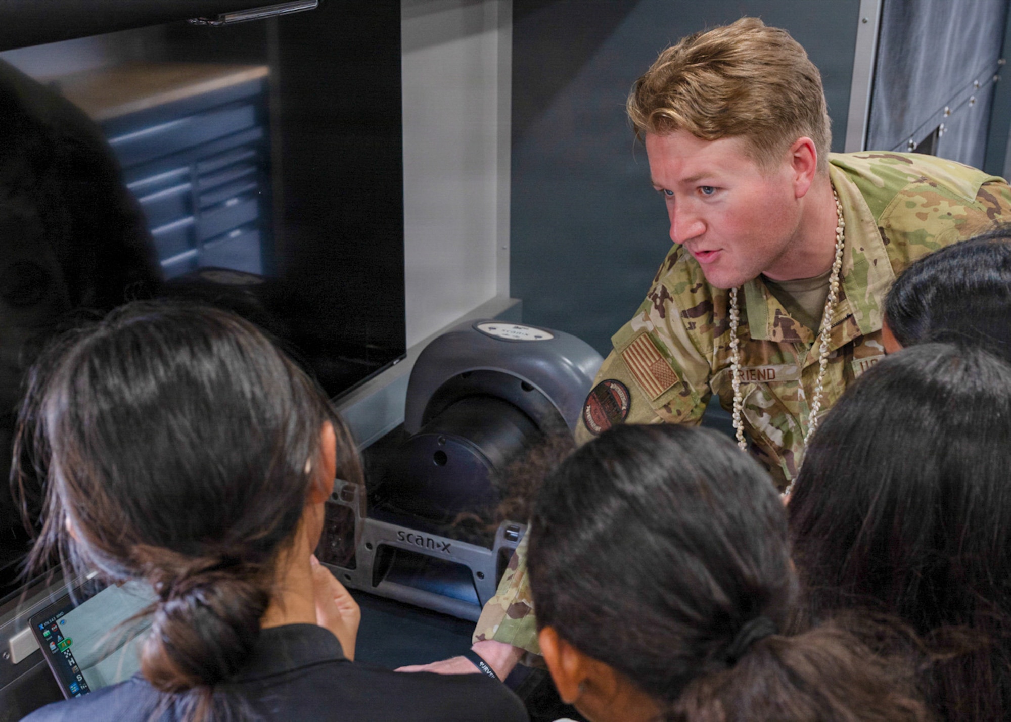 U.S. Air Force Senior Airman Kyler Friend, 36th Civil Engineer Squadron explosive ordnance disposal technician, demonstrates how to use a scanner inside an explosive ordnance disposal vehicle.