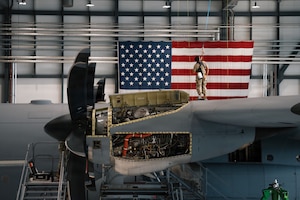 U.S. Air Force Airman 1st Class Jose Galindo-Barrios, 86th Maintenance Squadron aircraft electrical and environmental journeyman, is harnessed to the top of a C-130J Super Hercules to conduct letter-check repairs at Ramstein Air Base, Germany, June 3, 2026.