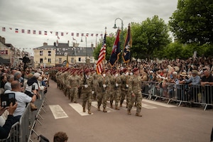 Paratroopers assigned to the 82nd Airborne Division march through the streets with Allied forces during the Grande Parade in Sainte Mere Eglise, France on June 05, 2025. The legacy of D-Day lives in our commitment to freedom, in our unity as nations, and in our determination to build a better future. (U.S. Army photo by Sgt. Noe Cork)