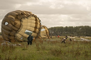 Paratroopers from Allied forces land on the drop zone at La Fiere, France, June 07, 2026. D-Day 82 commemorates the courage and sacrifice of Allied forces who fought for freedom, reminding us of the enduring strength of alliances and shared responsibility. (U.S. Army photo by Sgt. Noe Cork)