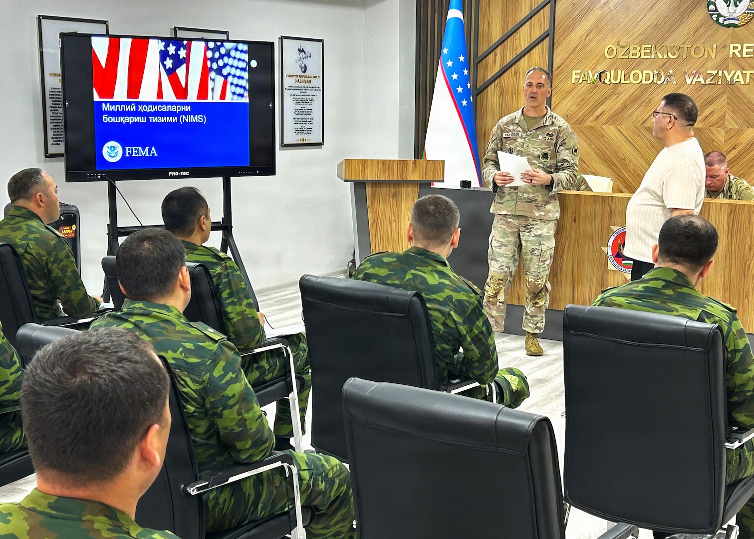 U.S. Army Warrant Officer Brett Patterson, Mississippi National Guard, discusses the U.S. National Incident Management System with Republic of Uzbekistan Ministry of Emergency Services personnel during a Department of War National Guard Bureau State Partnership engagement May 18, 2026, in Almalyk City, Uzbekistan.