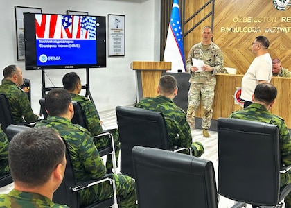 U.S. Army Warrant Officer Brett Patterson, Mississippi National Guard, discusses the U.S. National Incident Management System with Republic of Uzbekistan Ministry of Emergency Services personnel during a Department of War National Guard Bureau State Partnership engagement May 18, 2026, in Almalyk City, Uzbekistan.