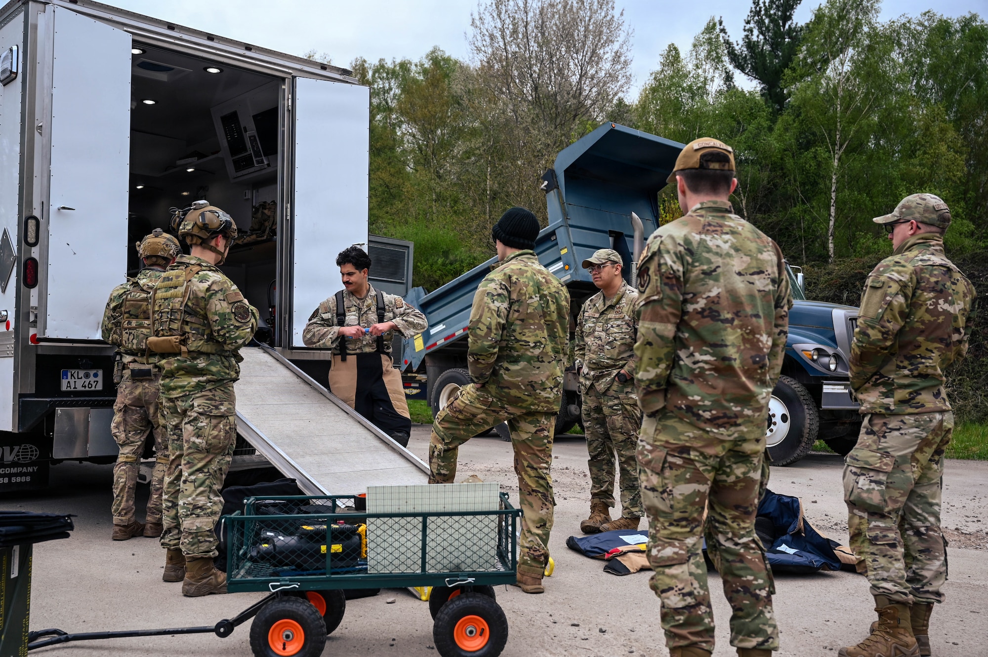 U.S. service members from the 786th Civil Engineer Squadron explosive ordnance disposal flight conduct a post-performance debrief