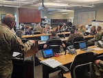 Representatives from multiple state agencies participate in a wildfire response tabletop exercise in Cheyenne, Wyoming, June 3, 2026. The exercise focused on improving coordination between state agencies and military organizations when responding to wildfires on Camp Guernsey and across Wyoming. Photo by Maj. Craig Heilig.