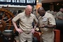 Vice Adm. Scott Gray, commander of Navy Installations Command, left, speaks with Command Master Chief Dennis Hathorn, command master chief of Naval Support Activity Washington, as he holds an M1852 Navy Officer's Sword during a ceremony at the National Museum of the United States Navy on the Washington Navy Yard, April 1, 2026.