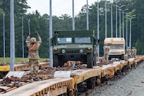 Virginia Army National Guard Soldiers assigned to the Staunton-based 116th Mobile Brigade Combat Team, or MBCT, unload vehicles and equipment from railcars June 3, 2026, at Fort Polk, Louisiana.
