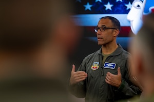 U.S. Air Force Gen. Adrian Spain, commander of Air Combat Command, speaks to attendees during the ACC Squadron Commander and Spouses Course at Joint Base Langley-Eustis, Virginia, April 13, 2026. The briefs familiarized attendees with the offices and resources available to Airmen and their families, ensuring no military family goes without the assistance they may need in times of hardship. (U.S. Air Force photo by Staff Sgt. Michael Bowman)