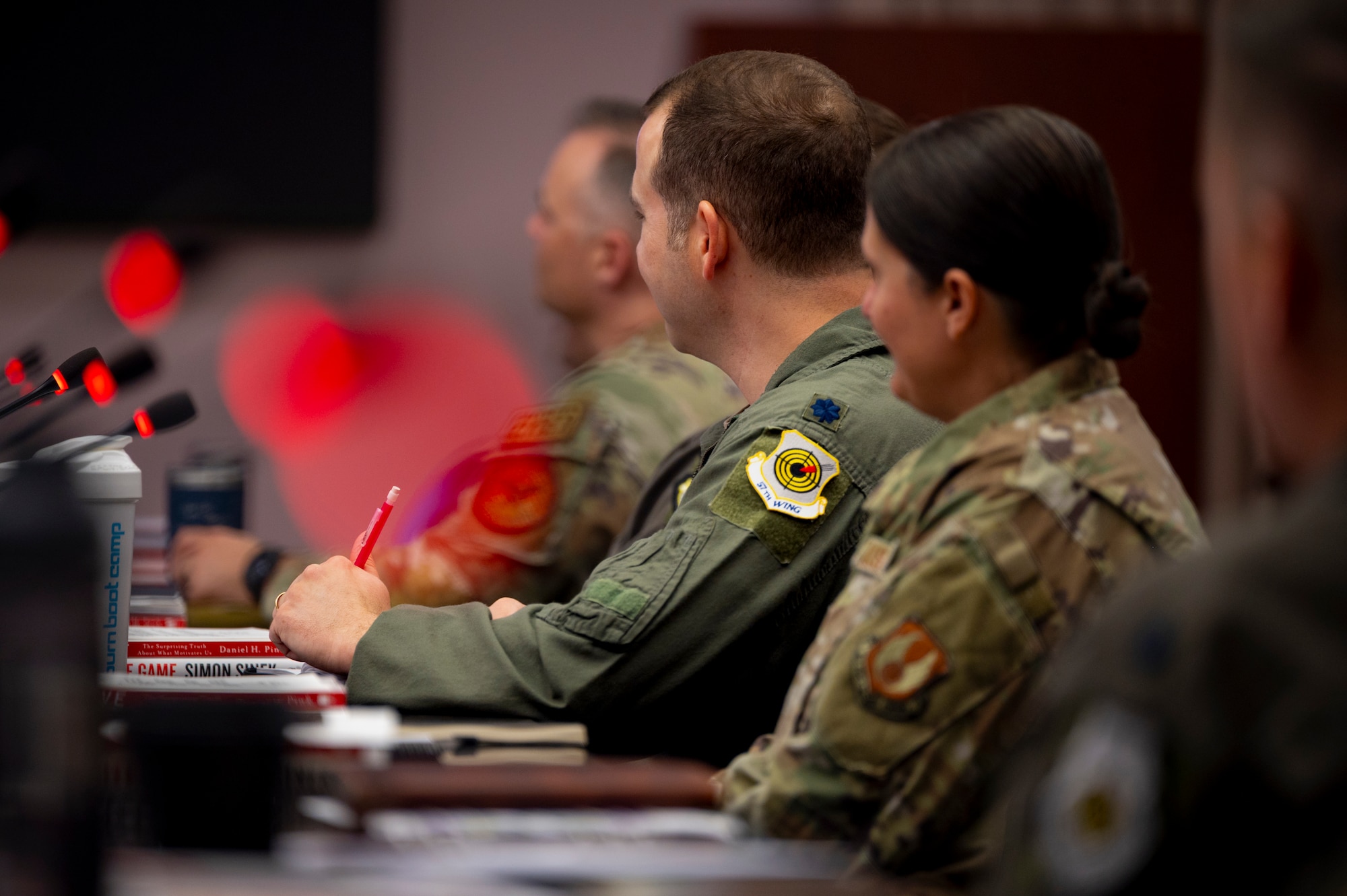 A new squadron commander takes notes during the Air Combat Command Commander and Spouses Course at Joint Base Langley-Eustis, Virginia, April 14, 2026. The course lasted four days, covering several topics vital to supporting Airmen and their families, while cultivating a warfighting culture across the major command. (U.S. Air Force photo by Staff Sgt. Michael Bowman)