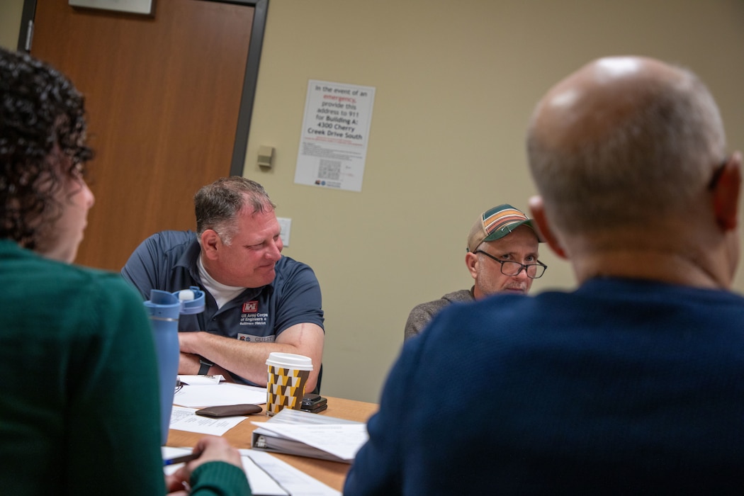 Wayne Davis, left, of the U.S. Army Corps of Engineers Baltimore District, attends a meeting at the Colorado Department of Public Health and Environment office to discuss the Land Use Controls Implementation Plan for the former Camp George West Artillery Range in Denver, April 30, 2026. (U.S. Army photo by Makenzie Leonard)