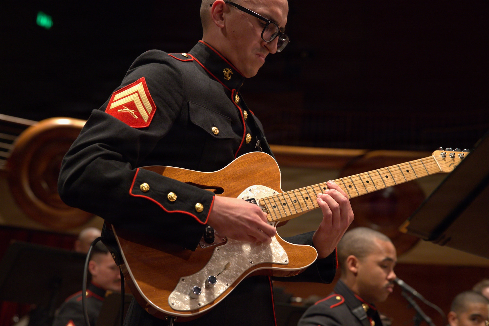 U.S. Marine Corps Cpl. Giovani Jauregui, a native from Hemet, California and the guitarist for Marine Forces Reserve (MARFORRES), playing the guitar at the Schwob School of Music, Columbus, Georgia on April 15, 2026. 6th Marine Corps District and the MARFORRES band take a tour throughout the Southeastern region promoting the Marine Corps Musician Enlistment option program (MEOP). (U.S. Marine Corps photo by Lance Cpl. Yovanik Calderon)