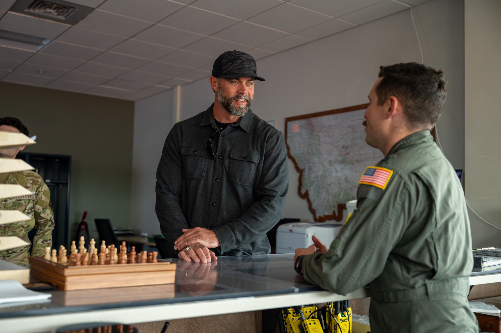 The Under Secretary of The Air Force speaks to a U.S. Air Force pilot.