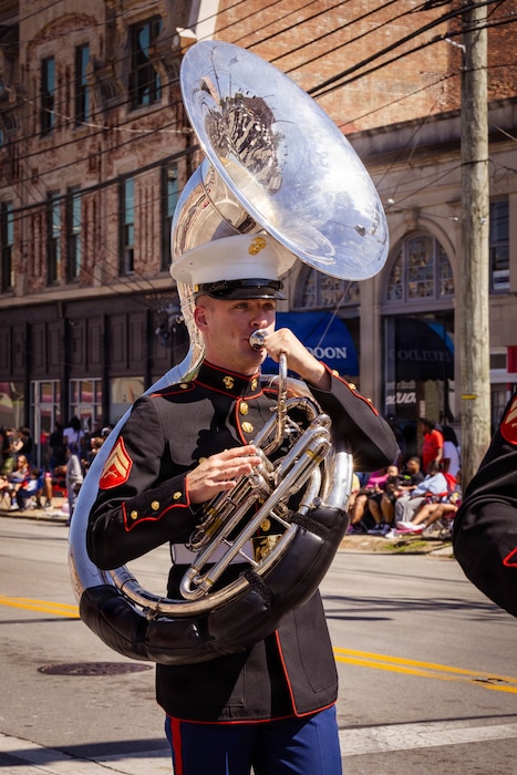 U.S. Marines with the Marine Corps Recruit Depot Parris Island Marine Band, march through the streets of Louisville, KY., during the Zoeller Pump Company Pegasus Parade on Apr. 26, 2026. The Parris Island Marine Band performed musical numbers alongside local organizations and performers for Louisville residents celebrating the Kentucky Derby. (U.S. Marine Corps photo by Lance Cpl. Jacob Claudell)