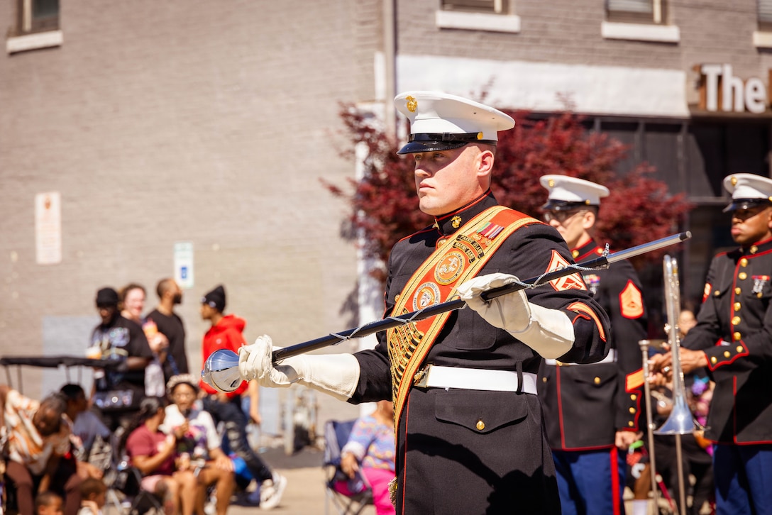 U.S. Marines with the Marine Corps Recruit Depot Parris Island Marine Band, march through the streets of Louisville, KY., during the Zoeller Pump Company Pegasus Parade on Apr. 26, 2026. The Parris Island Marine Band performed musical numbers alongside local organizations and performers for Louisville residents celebrating the Kentucky Derby. (U.S. Marine Corps photo by Lance Cpl. Jacob Claudell)