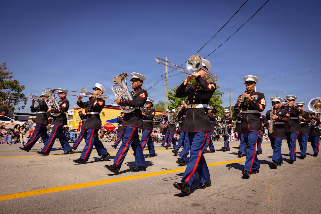 U.S. Marines with the Marine Corps Recruit Depot Parris Island Marine Band, march through the streets of Louisville, KY., during the Zoeller Pump Company Pegasus Parade on Apr. 26, 2026. The Parris Island Marine Band performed musical numbers alongside local organizations and performers for Louisville residents celebrating the Kentucky Derby. (U.S. Marine Corps photo by Lance Cpl. Jacob Claudell)