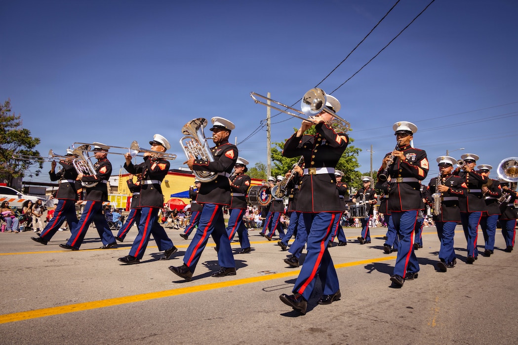 U.S. Marines with the Marine Corps Recruit Depot Parris Island Marine Band, march through the streets of Louisville, KY., during the Zoeller Pump Company Pegasus Parade on Apr. 26, 2026. The Parris Island Marine Band performed musical numbers alongside local organizations and performers for Louisville residents celebrating the Kentucky Derby. (U.S. Marine Corps photo by Lance Cpl. Jacob Claudell)