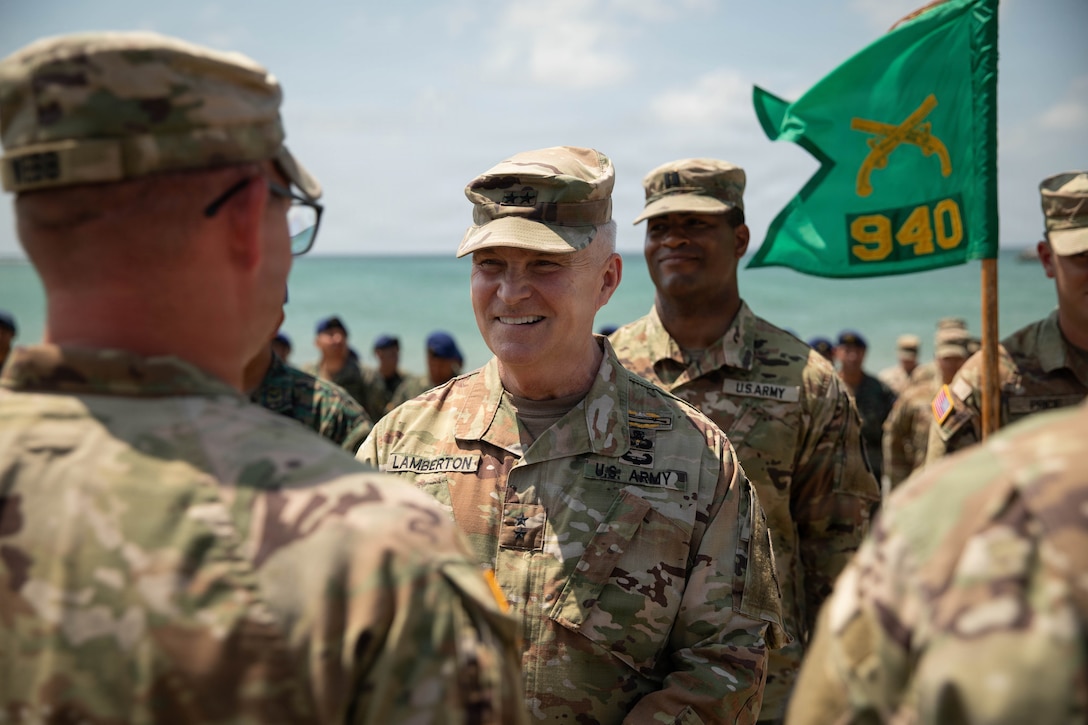Maj. Gen. Haldane Lamberton, adjutant general of the Kentucky National Guard, presents a coin to Sgt. 1st Class Joshua Webb in recognition of his performance during Exercise El Gato 2026 in Salinas, Ecuador, May 19, 2026.