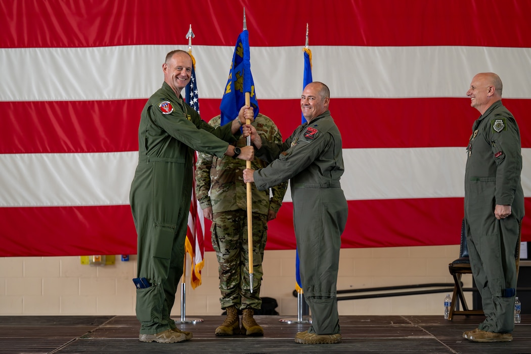 Man accepts guidon.