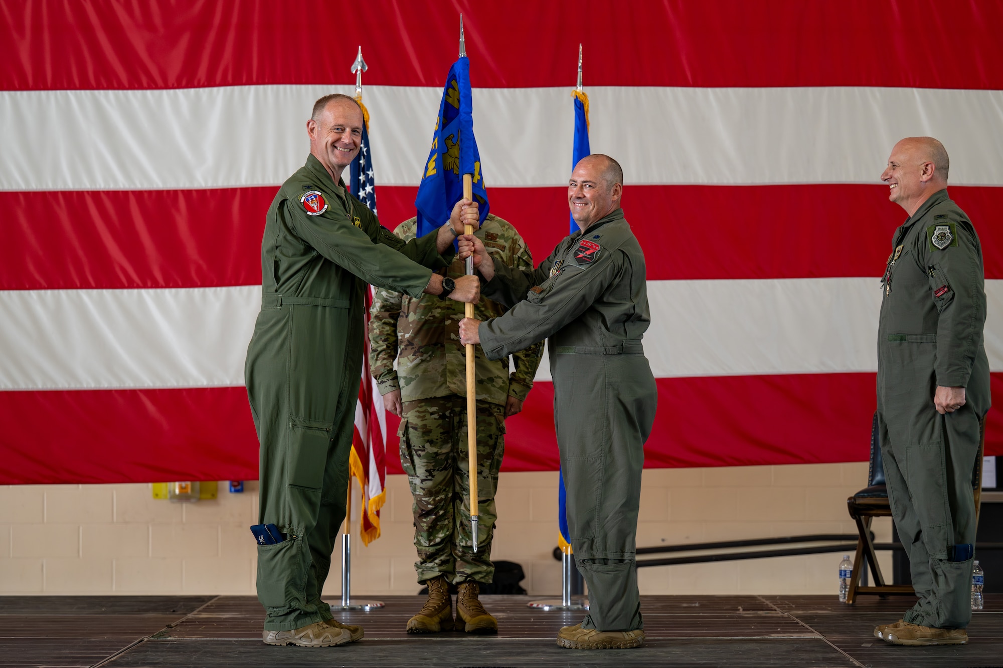 Man accepts guidon.