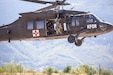 U.S. Army 1st Lieutenant Dustin Haubner with Task Force Griffin (KFOR 35, TF Aviation) looks toward the ground as the UH-60 Black Hawk takes off during ther deployment to Kosovo. (Courtesy photo)