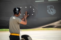 U.S. Air Force Airman 1st Class Edgar Rosas, 493rd Fighter Generation Squadron crew chief, conducts preflight checks to an F-35A Lightning II aircraft during Ramstein Flag 26 at Pirkkala Air Base, Finland, June 8, 2026. The exercise tests the 48th Fighter Wing's capacity for Agile Combat Employment, ensuring Airmen can sustain high-tempo combat operations with a minimal footprint in a distributed environment. (U.S. Air Force photo by Tech. Sgt. Christine Groening)