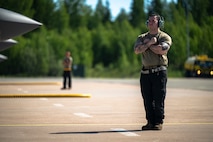 U.S. Air Force Staff Sgt. Christian Cornwell, 48th Equipment Maintenance Squadron wheel and tire technician, prepares to marshal an F-35A Lightning II aircraft during Ramstein Flag 26 at Pirkkala Air Base, Finland, June 8, 2026. Multi-capable Airmen from support and maintenance squadrons are vital to forward-deployed operations, seamlessly turning jets to keep NATO airpower in the sky. (U.S. Air Force photo by Tech. Sgt. Christine Groening)