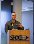 US Airman stands in front of a podium