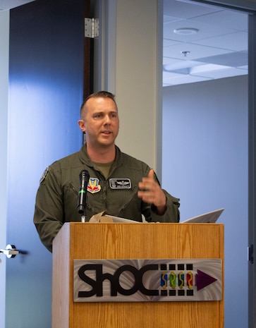 US Airman stands in front of a podium