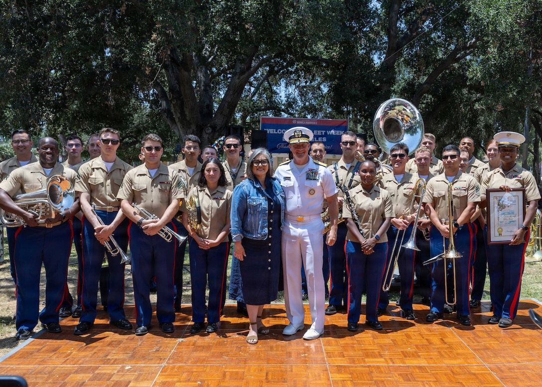 Rear Adm. Robert Nowakowski, Deputy Commander, Naval Education and Training Command, middle, takes a group photo with 3rd Marine Aircraft Wing band at the Band Park Memorial Day event during Los Angeles Fleet Week 2026, May 24, 2026. Los Angeles Fleet Week, now in its 10th year, is a sea service celebration that allows citizens of Greater Los Angeles to witness today's maritime capabilities firsthand. Nearly 1,500 Sailors, Marines and Coast Guardsmen will showcase their capabilities and equipment, participate in various community service events, and enjoy the hospitality of Los Angeles during the event. (U.S. Navy photo by Mass Communication Specialist 2nd Class Gavin Arnoldhendershot)