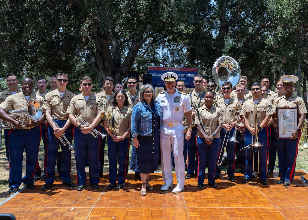 Rear Adm. Robert Nowakowski, Deputy Commander, Naval Education and Training Command, middle, takes a group photo with 3rd Marine Aircraft Wing band at the Band Park Memorial Day event during Los Angeles Fleet Week 2026, May 24, 2026. Los Angeles Fleet Week, now in its 10th year, is a sea service celebration that allows citizens of Greater Los Angeles to witness today's maritime capabilities firsthand. Nearly 1,500 Sailors, Marines and Coast Guardsmen will showcase their capabilities and equipment, participate in various community service events, and enjoy the hospitality of Los Angeles during the event. (U.S. Navy photo by Mass Communication Specialist 2nd Class Gavin Arnoldhendershot)