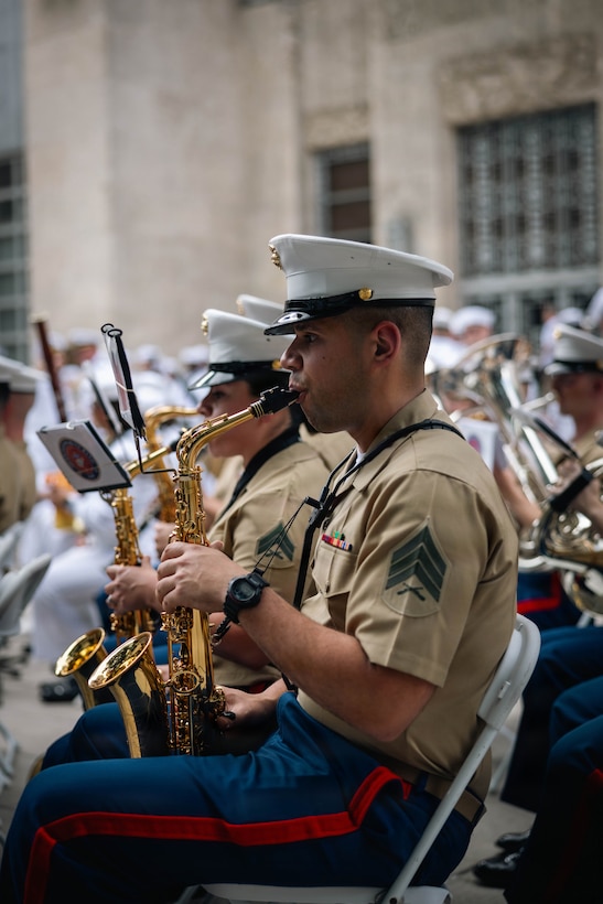 U.S. Marine Corps Sgt. Kenny Valentine, a Saxophone player with the Quantico Marine Corps Band performs for the opening ceremony at Houston City Hall in Houston, Texas, April 15, 2026. Fleet Week is a celebration of the U.S. Navy, Marine Corps, and Coast Guard, typically held in various cities across the United States. It features a parade of Navy and Coast Guard ships, public ship tours, and a variety of events honoring military service, with the city of Houston being the first time in its history hosting the event. (U.S. Marine Corps photo by Cpl. Darien Wright)
