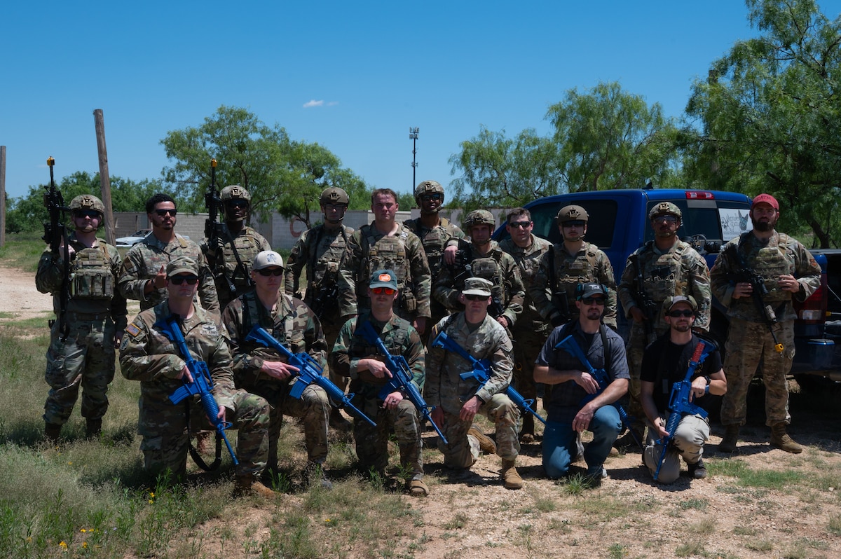 U.S. Air Force Airmen, U.S. Army Soldiers, and San Angelo Police Department officers pose for a group photo during an advanced deployment capability demonstration at Goodfellow Air Force Base, Texas, May 13, 2026. The demonstration showcased the lesser known capabilities the 17th Security Forces Squadron utilize while in a deployed environment. (U.S. Air Force photo by Senior Airman Brian Lummus)