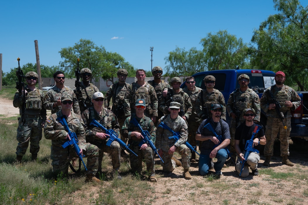 U.S. Air Force Airmen, U.S. Army Soldiers, and San Angelo Police Department officers pose for a group photo during an advanced deployment capability demonstration at Goodfellow Air Force Base, Texas, May 13, 2026. The demonstration showcased the lesser known capabilities the 17th Security Forces Squadron utilize while in a deployed environment. (U.S. Air Force photo by Senior Airman Brian Lummus)