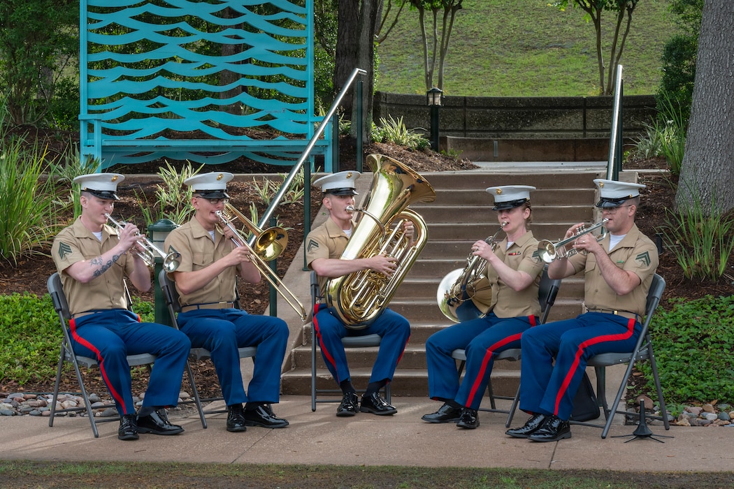 U.S. Marine Corps service members assigned to the Quantico Marine Band perform during a wreath-laying ceremony at the Medal of Honor Monument in The Woodlands, Texas, April 21, 2026, as part of Fleet Week Houston. The ceremony honored Marine Corps Medal of Honor recipients from Texas, recognizing their valor and sacrifice in service to the nation. More than 1,000 Sailors and Marines from the visiting fleet proudly engage with the people of Houston during Texas’ first-ever Fleet Week, showcasing the professionalism and warfighting readiness of America’s sea services while celebrating 250 years of dedicated Navy and Marine Corps service as part of the Nation’s Freedom 250 commemoration. (U.S. Navy photo by Mass Communication Specialist 1st Class Louis Rojas)