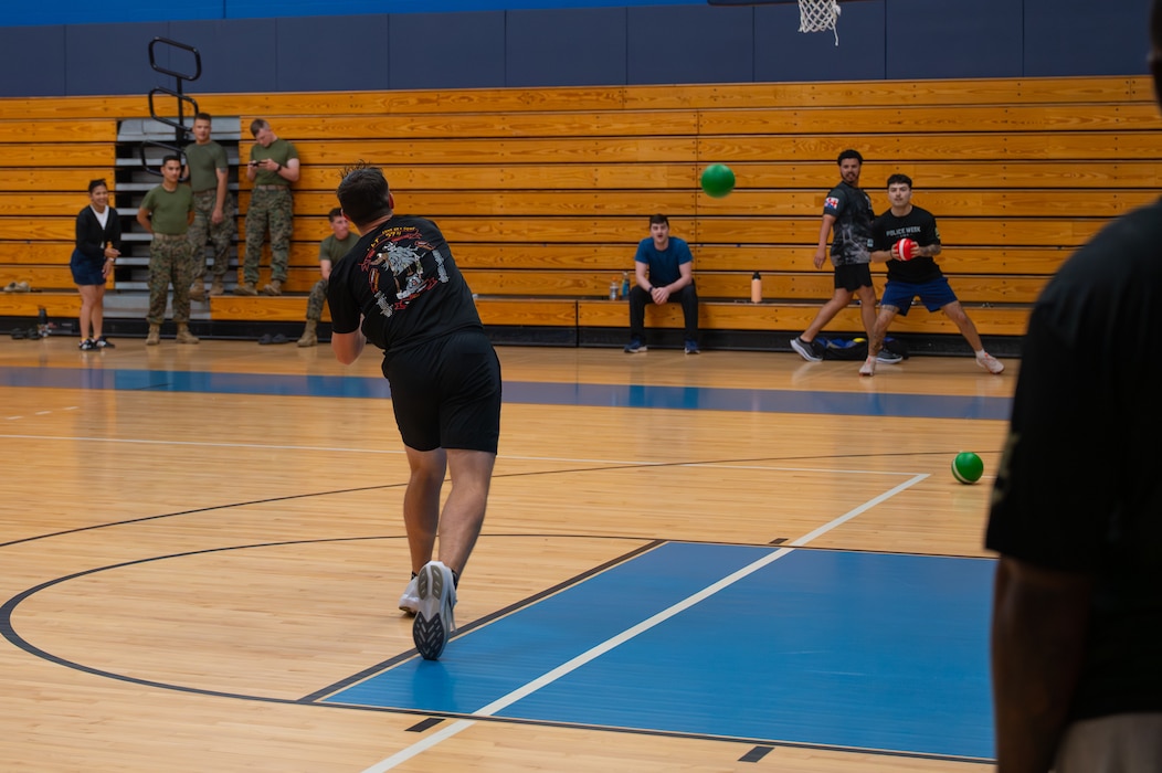 U.S. Airmen from the 17th Security Forces Squadron and members across the installation compete in a dodgeball tournament at Goodfellow Air Force Base, Texas, May 14, 2026. Defenders hosted a dodgeball tournament, open to everyone, to give people a chance to win prizes, interact with defenders and build resiliency during National Police Week. (U.S. Air Force photo by Senior Airman Brian Lummus)