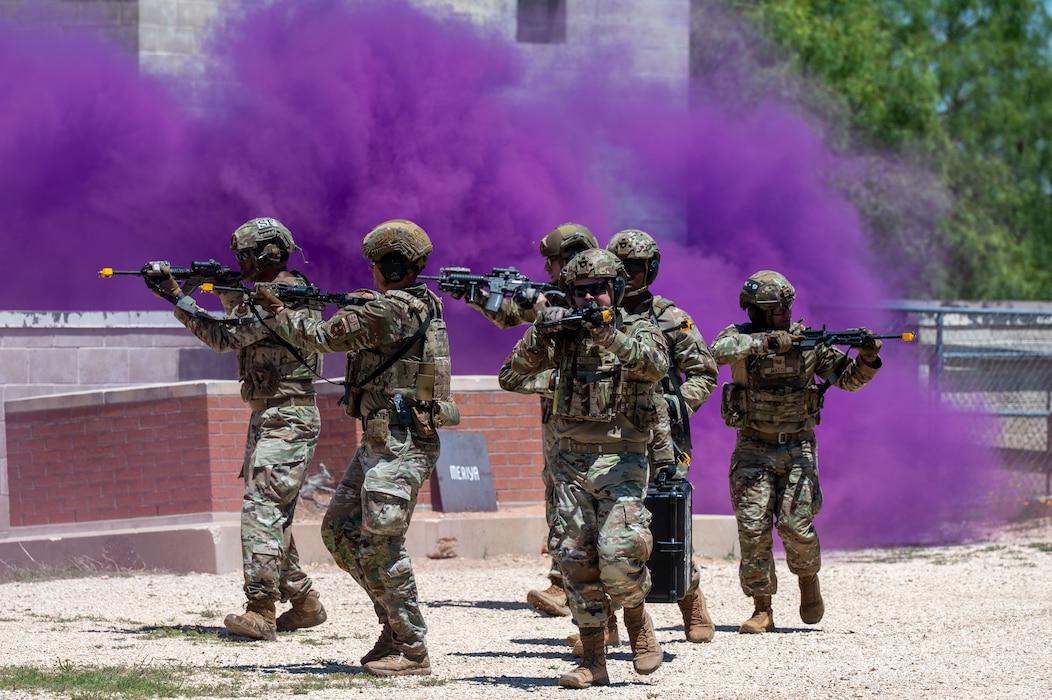 U.S. Airmen from the 17th Security Forces Squadron conduct an advanced deployment capability demonstration during National Police Week at Goodfellow Air Force Base, Texas, May 13, 2026. The demonstration showcased expeditionary security forces tactics and capabilities while honoring fallen law enforcement officers and defenders during the week-long observance. (U.S. Air Force photo by Senior Airman James Salellas)