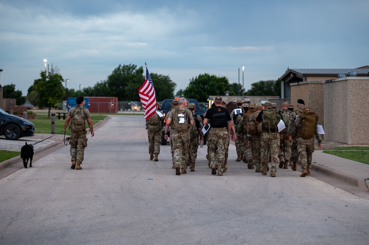 Members from across the 17th Training Wing conduct a fallen hero's ruck during National Police Week at Goodfellow Air Force Base, Texas, May 15, 2026. The ruck served as a physical tribute to law enforcement officers and defenders who made the ultimate sacrifice in the line of duty. (U.S. Air Force photo by Senior Airman James Salellas)