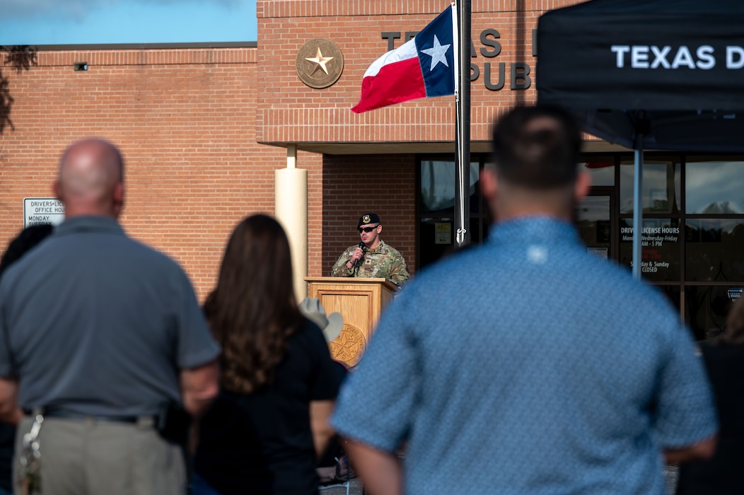 U.S. Air Force Maj. Jonathan Estep, 17th Security Forces Squadron commander, delivers remarks during the National Police Week opening ceremony at the Texas Department of Public Safety office in San Angelo, Texas, May 12, 2026. The ceremony, held in partnership with local law enforcement agencies, marked the beginning of Goodfellow Air Force Base's week-long observance honoring fallen law enforcement officers and defenders who made the ultimate sacrifice in the line of duty. (U.S. Air Force photo by Senior Airman James Salellas)