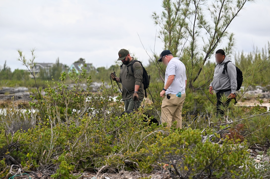 CGIS Investigators, RBDF personnel and K-9 Maggie from Broward County Sheriff’s Office search for a missing person during a CGIS investigation in the Bahamas, Jun. 3, 2026. Search operations employed a range of specialized capabilities, including divers, remotely operated underwater vehicles, unmanned aerial systems, and a cadaver dog to thoroughly examine newly identified areas of interest. (U.S. Coast Guard photo by Petty Officer 1st Class Riley Perkofski)