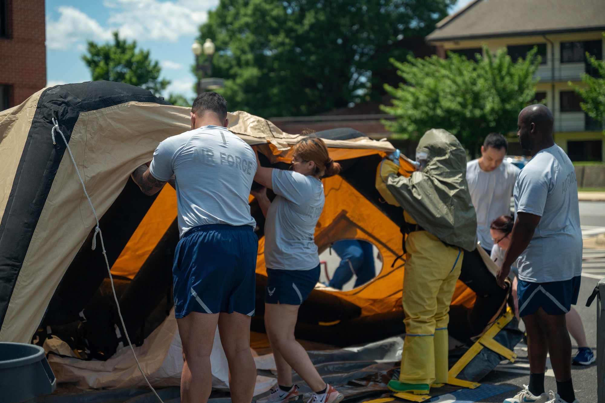 Airmen set up a contamination tent.