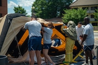 Airmen set up a contamination tent.
