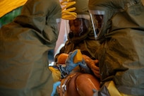 Airmen treat a medical manakin.