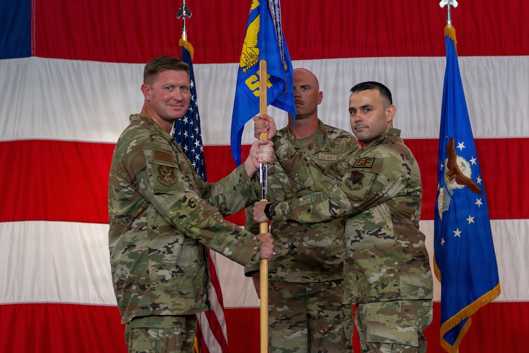 A group commander passing a guidon to a new commander.