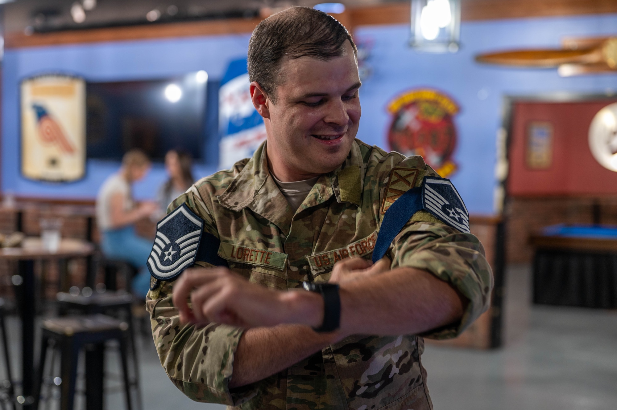 Tech. Sgt. Noah Lorette equips a temporary master sergeant rank on his sleeve.