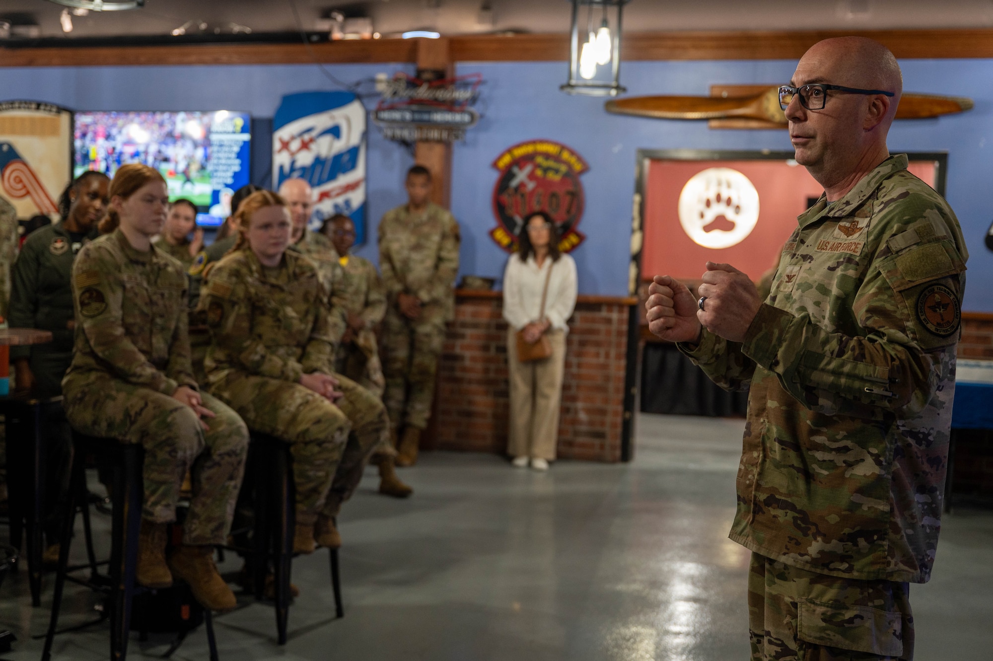 Base commander gives remarks to crowd of Airmen.