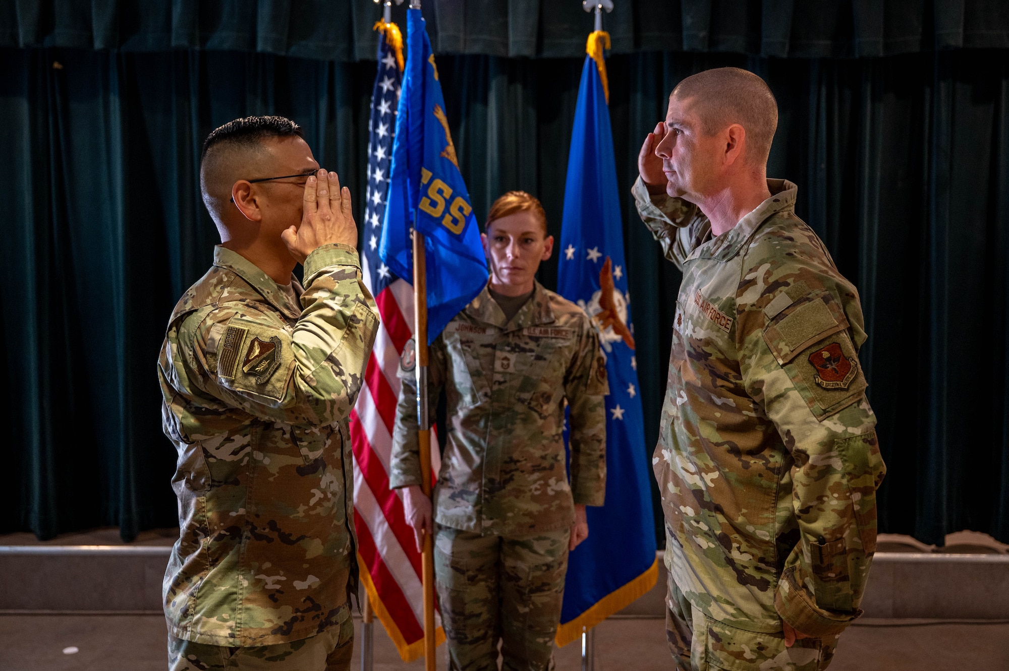 From the left, Col. Peter Joo salutes back to Maj. Brian Cockroft during the 47th FSS assumption of command ceremony.